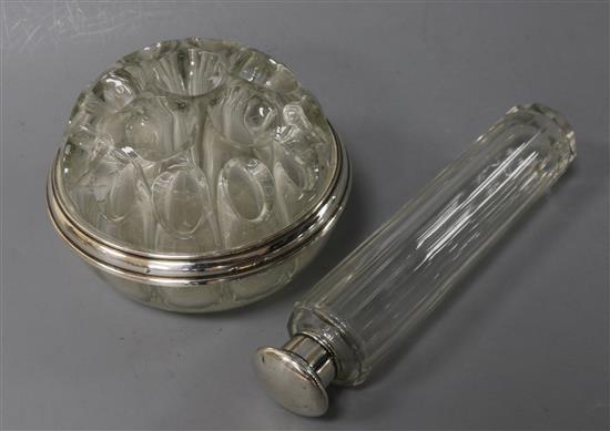 A French silver-mounted flower holder and a silver and glass toilet bottle.